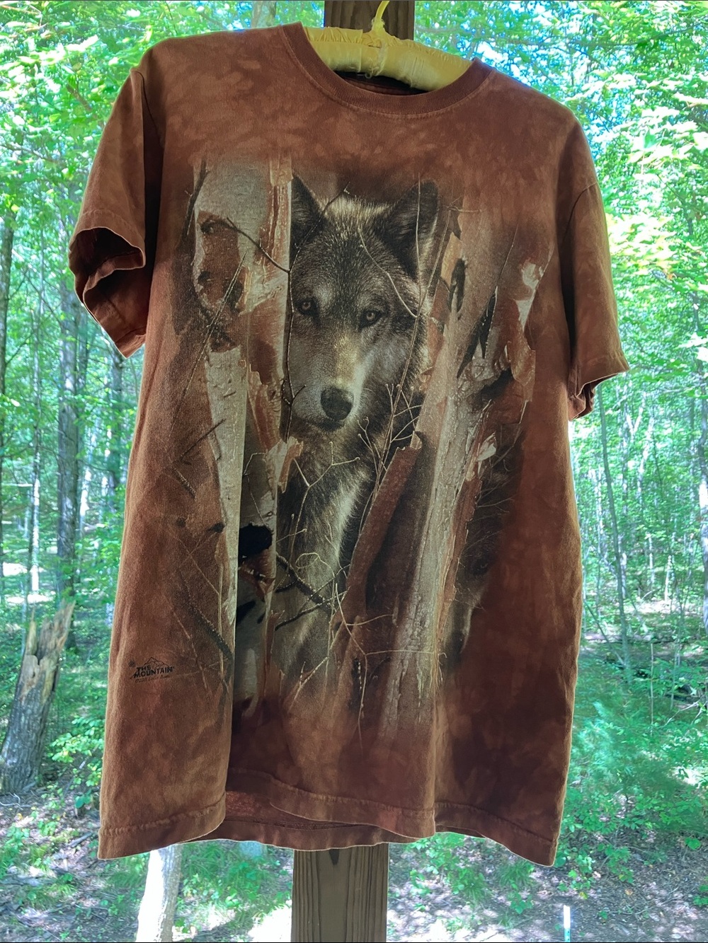 The Mountain Men’s M “Guardian Wolf” dye graphic short sleeve tee. Brown shades